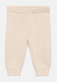 Puha kötött, krémszínű babanadrág elasztikus derékpánttal és bordázott mandzsettákkal, melegség és kényelem érdekében tervezve.