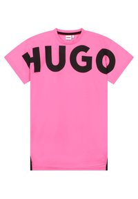 T-shirt rosa in cotone con lettere nere audaci che formano la scritta "HUGO", maniche corte e una vestibilità comoda con spacchi laterali all'orlo.