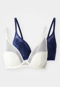 Draadloze bh met marineblauwe kantdetails aan één kant en crème stof aan de andere kant, mesh panelen, verstelbare bandjes en gladde cups.