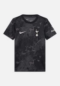 Svart kortermet Nike-trøye med et tonalt abstrakt mønster, med en hvit logo og et lagmerke på venstre bryst.