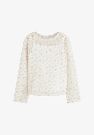 Langærmet hvid top med et blomstermotiv og rosa accenter. Blødt stof med rund halsudskæring og lige snit. Ingen synlige lukninger.