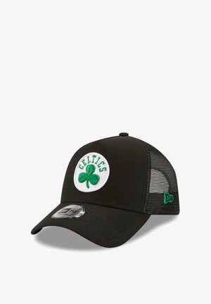 Black mesh baseball cap with a rounded visor, featuring a green shamrock and "CELTICS" logo on a white circular patch. Adjustable backstrap.
