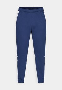 Pantalones de chándal azul marino hechos de una tela suave y elástica, con una cintura ajustable por cordón y rayas blancas en los laterales para un toque adicional.