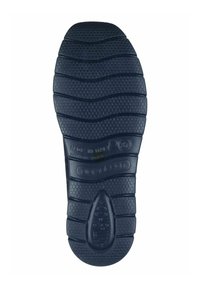 Black rubber shoe sole with textured hexagonal and wavy patterns, featuring branding and made in Italy markings.