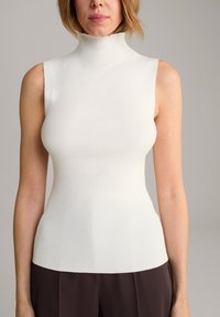 Rippenshirt ohne Ärmel in Weiß mit hohem, gewellten Ausschnitt. Enganliegendes Design, das eine glatte Textur und eine minimalistische Silhouette präsentiert.