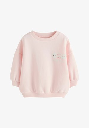 Jasnoróżowa dresowa bluzka dla malucha z długim rękawem, z prążkowanymi mankietami i dołem, zdobiona małymi postaciami uśmiechniętych pierożków oraz napisem "little bao" na przodzie.