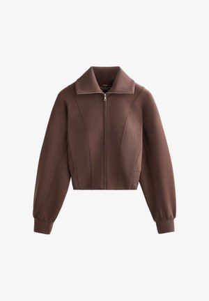 Bruine cropped jas met een ritssluiting aan de voorkant, een brede kraag en een geribbelde textuur. Heeft licht opgeblazen mouwen en subtiele zijnaden.