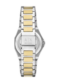 Stříbrný nerezový řemínek na hodinky s pozlacenými obdélníkovými akcenty. Disponuje osmiúhelníkovým pouzdrem a rytým logem na zadní straně.