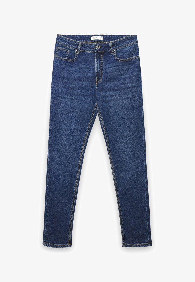 Jeans in denim blu scuro con design aderente, cinque tasche, chiusura con bottone e dettagli di cuciture visibili. Tessuto liscio e gambe affusolate.