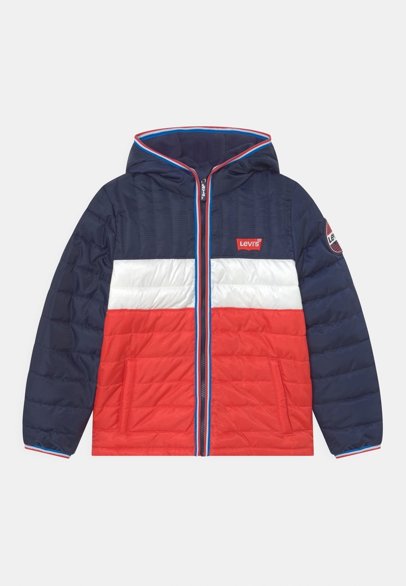 Pružná bunda v námořnické, červené a bílé barvě s blokovým designem. Obsahuje kapuci, přední zip a logo Levi's na hrudi.