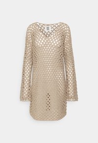 Tunique beige en crochet tricoté, manches longues et col en V, avec un motif losange ajouré.