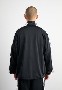 adidas Originals MEGABREAK - Training jacket - black