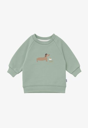 Green sweatshirt with a crew neck and raglan sleeves. Features a cartoon dachshund graphic with the text “WOOF” in a light fabric.