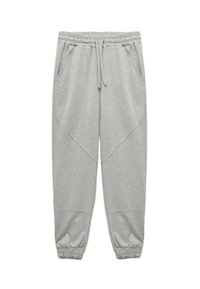 Grå sweatpants lavet af blødt stof, med elastisk talje, snorelukning og ribbede manchetter. Indeholder sidelommer.