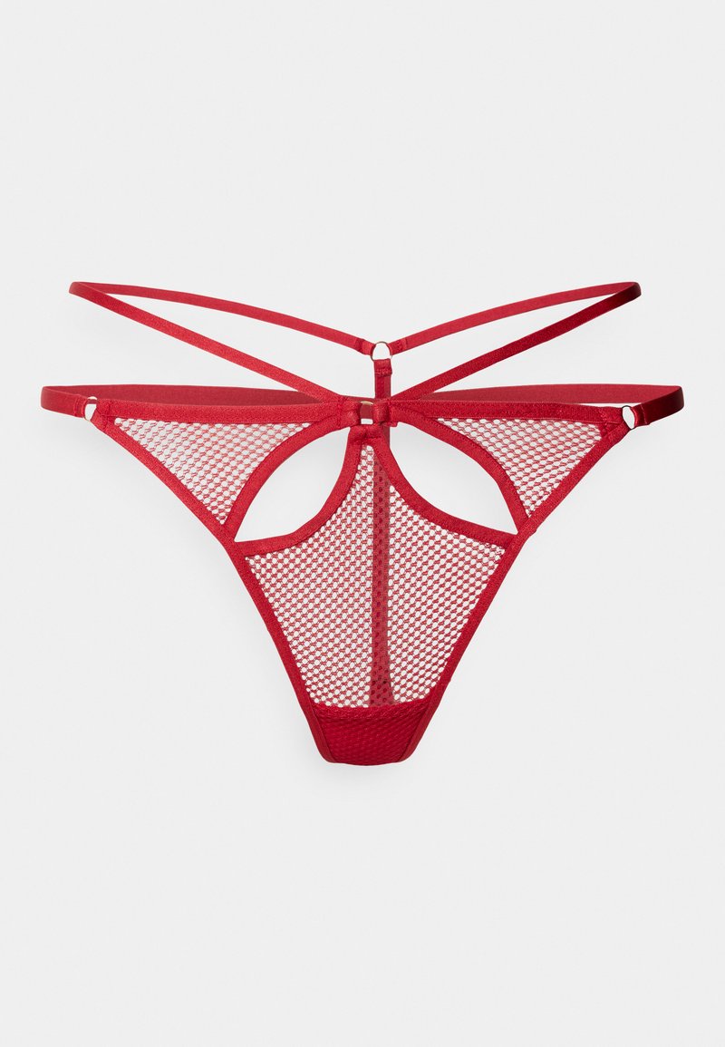 Roter Netzstring mit offenem Rücken, der mit über Kreuz verlaufenden Trägern und einem dekorativen Ausschnitt in der Mitte gestaltet ist. Weiches und strukturiertes Material.