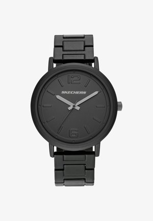 Montre-bracelet en métal noir avec bracelet à maillons, aiguilles grises des heures et des minutes, aiguille des secondes et chiffres 12 et 6 en relief, nom de marque Skechers sur le cadran.