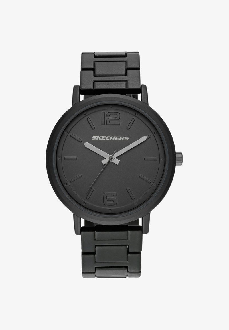 Reloj de pulsera de metal negro con pulsera enlazada, manecillas grises de horas y minutos, segundero y números elevados 12 y 6, nombre de la marca Skechers en la esfera.
