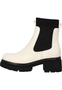 Botín de tobillo con tacón grueso en cuero crema, con un panel elástico negro. Presenta una suela de goma texturizada y lengüetas para facilitar su uso.