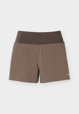 Pruunid spordipüksid laia tumepruuni vöökohaga ja väikese helkiva logoga alumisel vasakul säärtel.