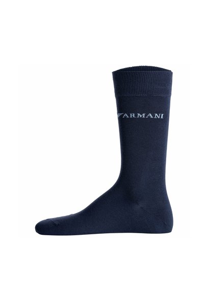 Chaussette bleu marine mi-mollet avec bord-côte et logo texte blanc « ARMANI » sur le côté.