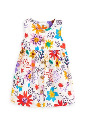 Robe blanche sans manches avec des imprimés colorés de fleurs et d'oiseaux, boutons en bois sur le devant et taille froncée avec une poche à l'avant.