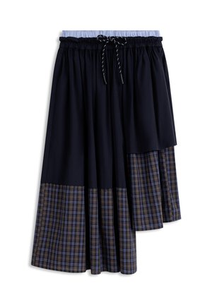 Jupe noire avec ourlet plissé à carreaux bleus et bruns, taille élastique avec doublure intérieure bleu clair et cordon de serrage noir à l'avant.