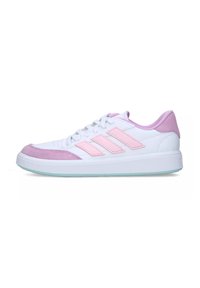 White sneakers with pink suede accents, rubber sole, and three pink stripes. Features a lace-up design and padded tongue and collar.