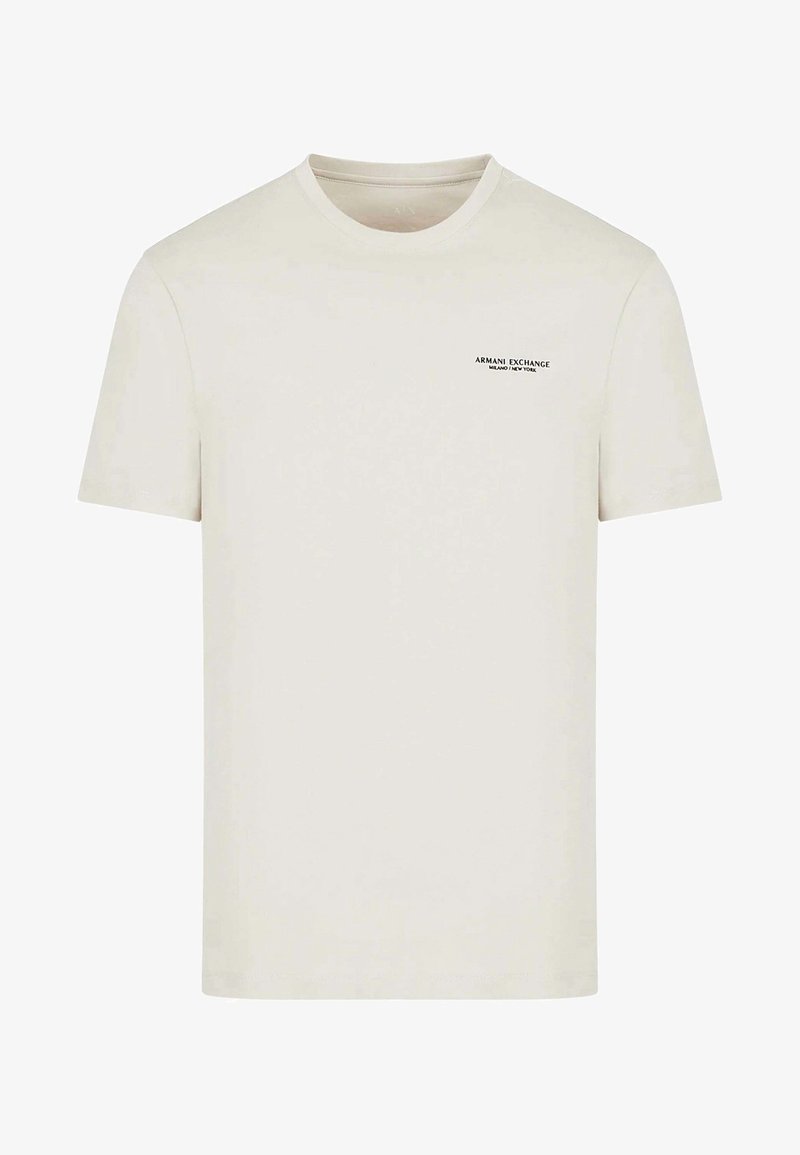 T-shirt à manches courtes de couleur blanc cassé Armani Exchange avec petit logo noir sur le haut à gauche de la poitrine.