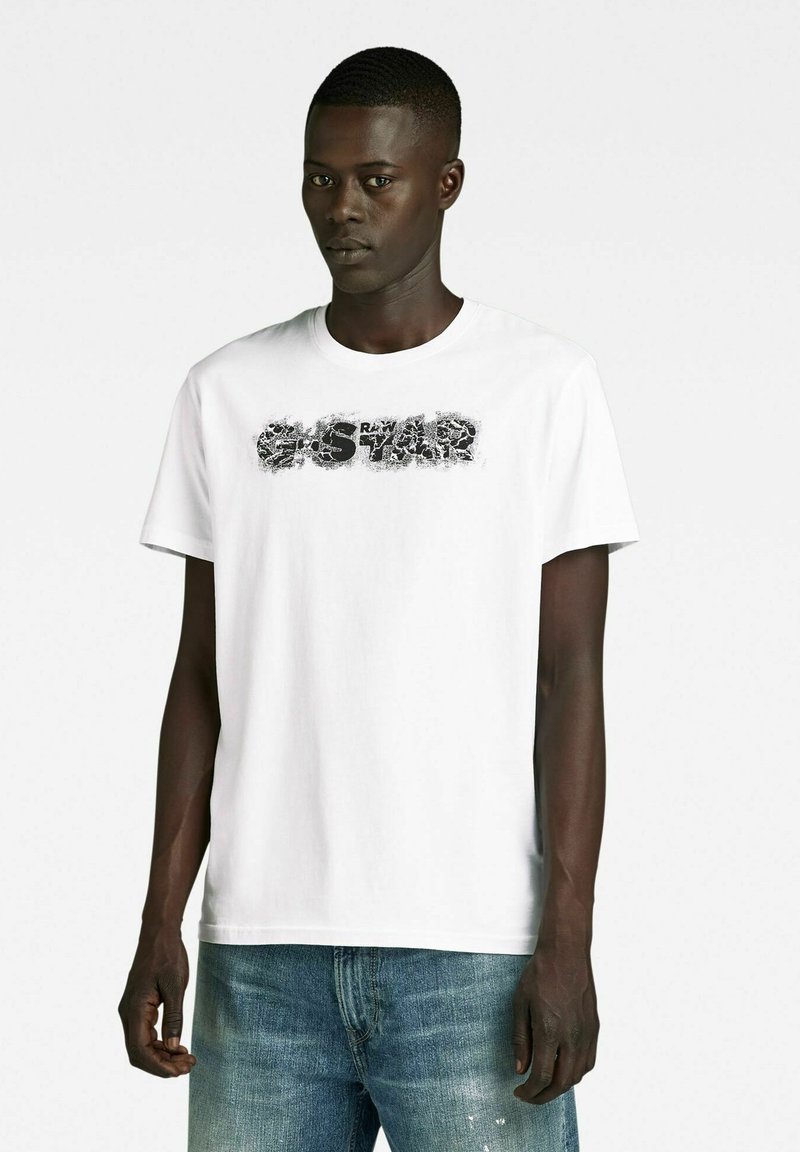 Maglietta Uomo G-Star Raw - T-Shirt Logo Distressed Stile Casual E Maglietta Uomo G-Star Raw - T-Shirt Logo Distressed Stile Casual E