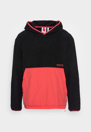 Czarna polarowa bluza z kapturem z jasnokoralową przednią kieszenią, obszyciem kaptura i logo Adidas na piersi.
