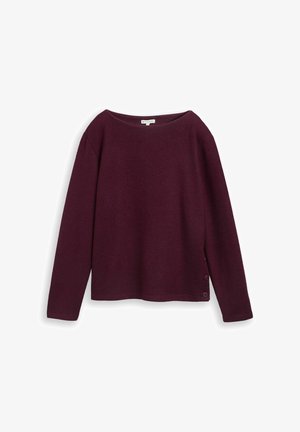 Burgundy sweater in soft knit fabric with a wide neckline, long sleeves, and button detail at the side hem. Smooth texture, relaxed fit.