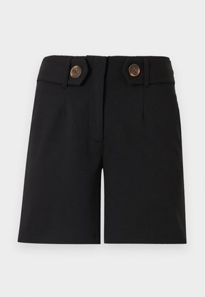 Shorts noirs sur mesure à taille haute, avec deux grands boutons marron sur les pattes latérales et un détail de couture frontale.