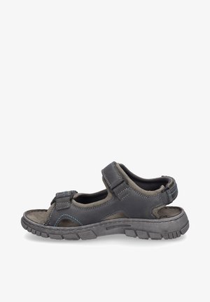 Sportovní sandál v tmavě šedé a světlé šedé barvě se suchým zipem, texturovanou stélkou a gumovou podešví s hlubokými drážkami pro lepší přilnavost.