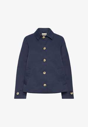 Tumesinist värvi jakk, mis on valmistatud siledast materjalist, varustatud klassikalise krae, kuue messingist nupu ja küljetaskutega. Detailidena on nööpidega varrukakitsendid.