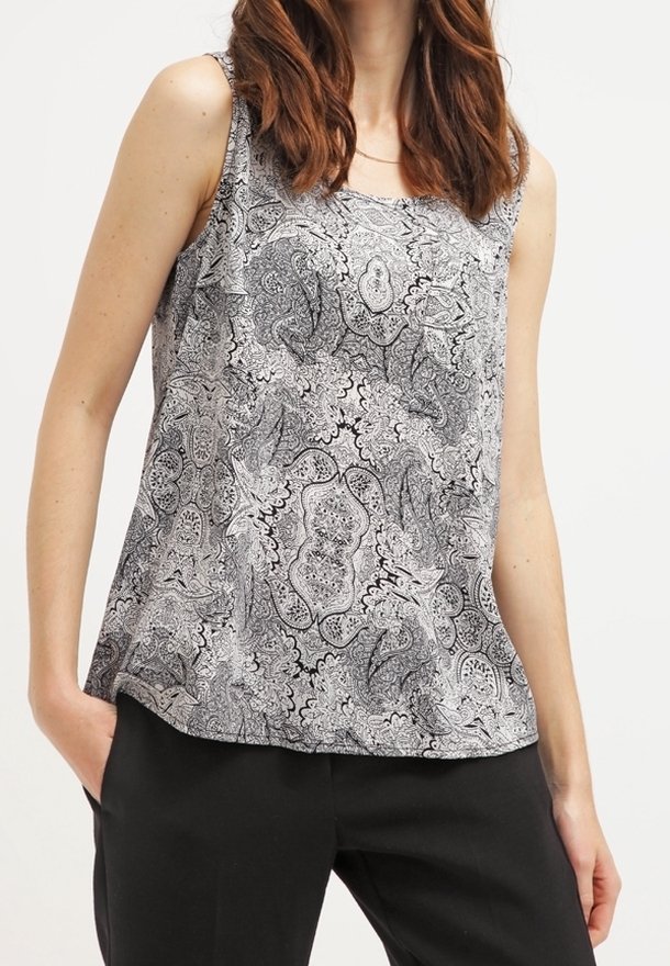 Tílko s černobílým paisley vzorem, výstřihem do oblouku, bez rukávů a volným střihem. Měkká látka s hladkým povrchem.