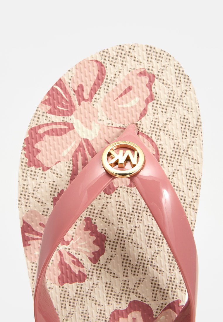 Rosa Gummisandale mit floralem Muster und strukturiertem Innensohle. Verfügt über ein goldenes, kreisförmiges Logo-Detail in der Mitte des Riemens.