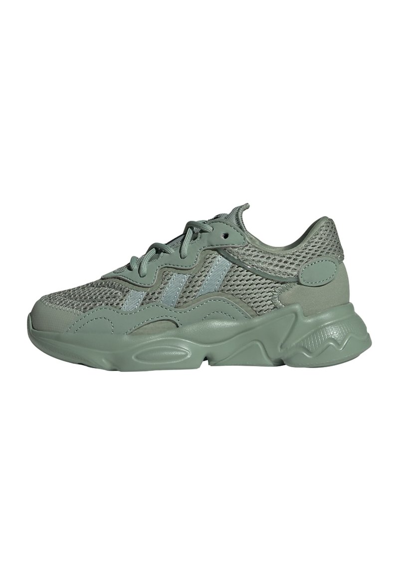 Light green mesh and synthetic sneakers featuring a textured sole, padded collar, and contrasting blue accents on the sides.