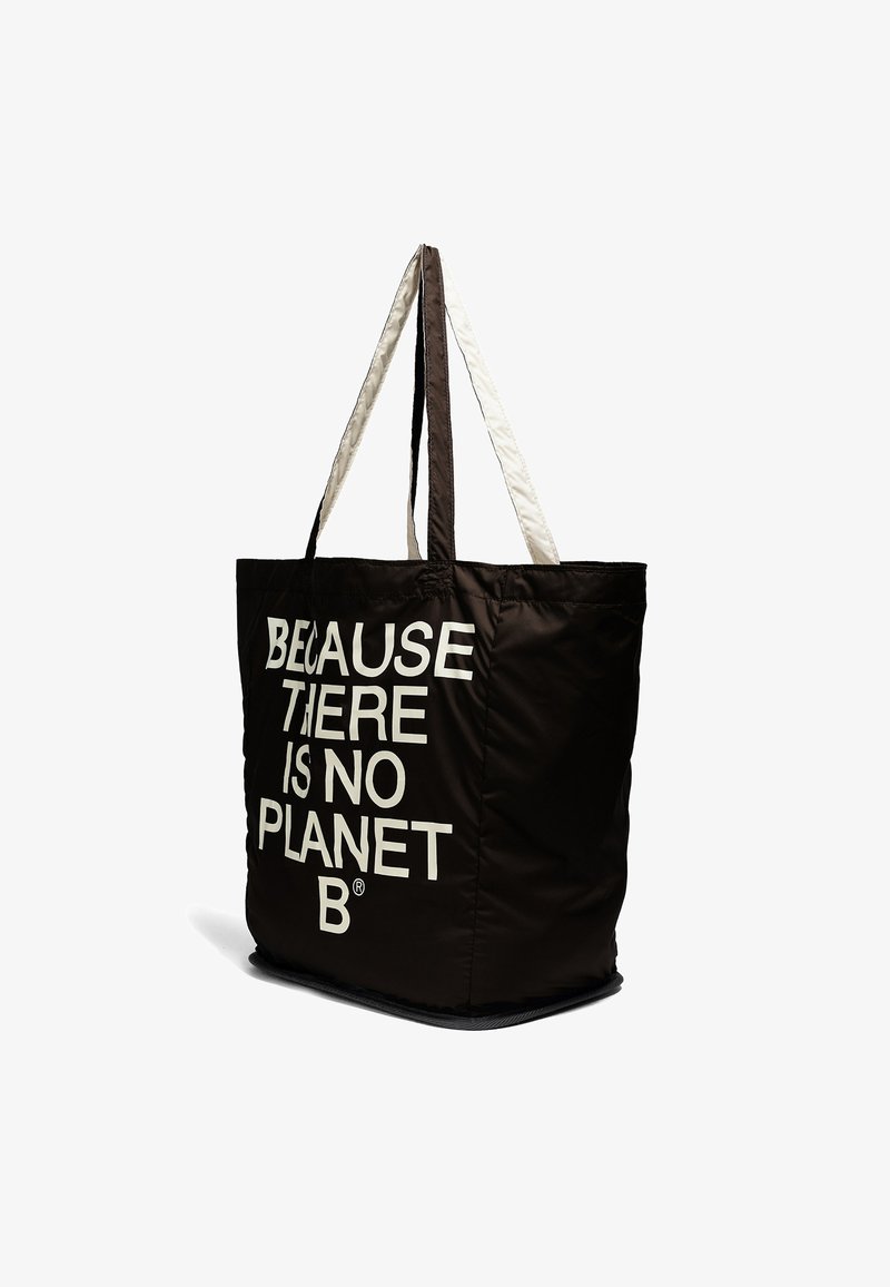 Sac fourre-tout noir réutilisable avec des poignées blanches et le texte "Because there is no Planet B" imprimé en blanc sur le devant.