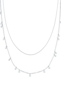 Silver-tone layered necklace featuring two chains, both adorned with small round pendants, smooth texture, and a delicate design.