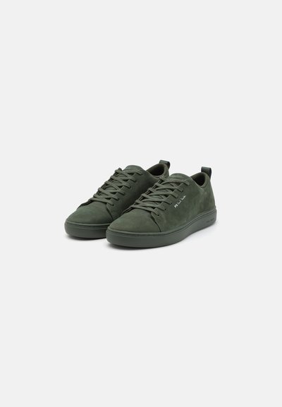 Green suede sneakers with a low profile, round toe, and lace-up design. Features a textured surface and a flat rubber sole.