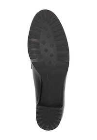 Chaussure en cuir noir avec une semelle en caoutchouc texturée, présentant un motif à crampons pour une adhérence optimale et un logo de marque embossé. L'intérieur est lisse et sans ornement.