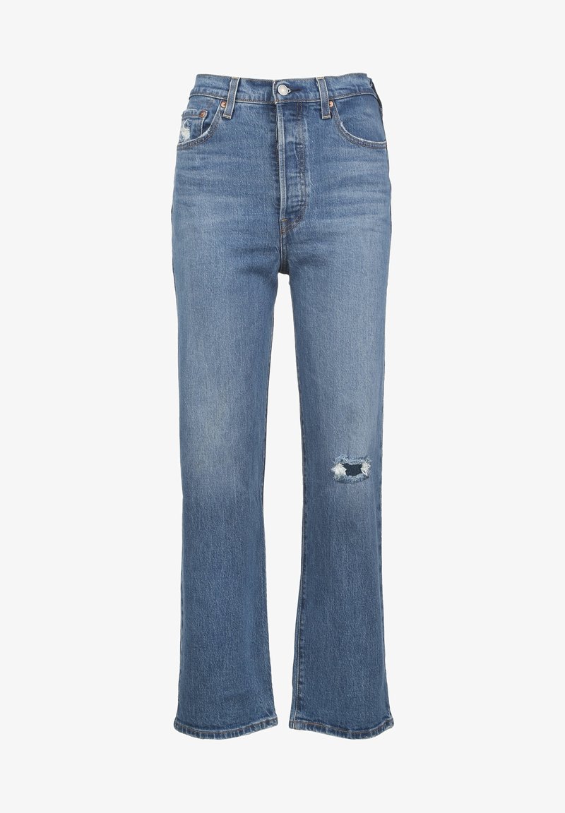 Höga blå jeans i denim, med lös passform, ett slitet knä med fransar och klassisk femfickdesign.