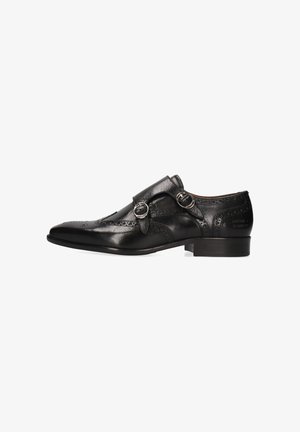 Scarpa elegante con doppia fibbia monk in pelle nera, dettagli brogue, fibbie argentate, tacco basso e punta appuntita.