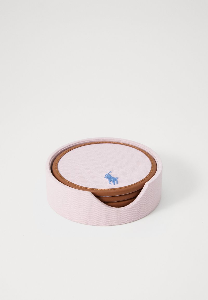 Pink round coaster holder with textured fabric, featuring a brown leather base and blue logo. Includes multiple round coasters inside.