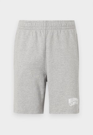 Shorts en coton gris avec une taille élastique et un logo blanc en bas à droite. Texture douce, design jusqu'aux genoux.