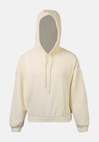 Felpa color crema con un tessuto morbido e testurizzato sulle maniche. Presenta un cappuccio con cordini e un design rilassato e cropped.