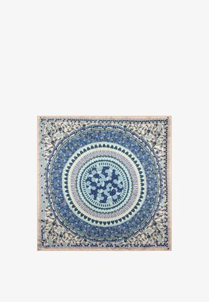 Tissu carré avec des motifs circulaires concentriques en bleu, blanc et beige présentant des dessins floraux et géométriques.
