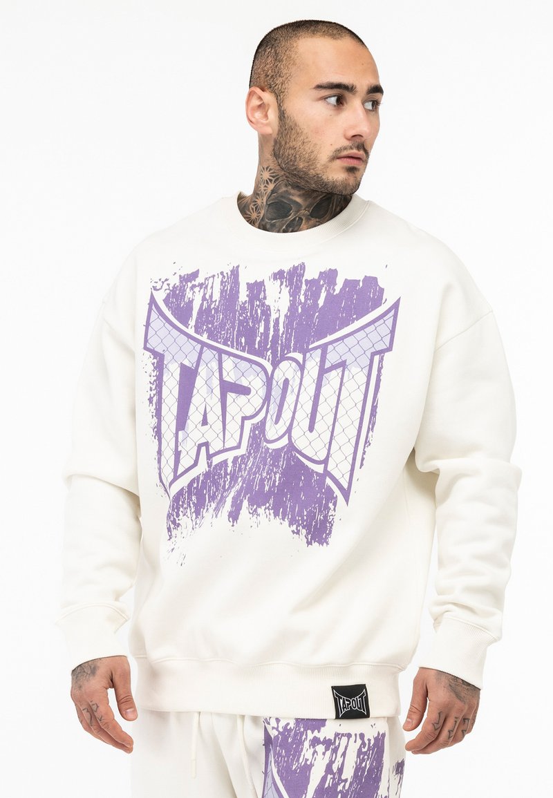 Cremefarvet sweatshirts med et iøjnefaldende lila TAPOUT grafisk design med en struktureret overflade. Den har en afslappet pasform og ribbede manchetter for komfort.