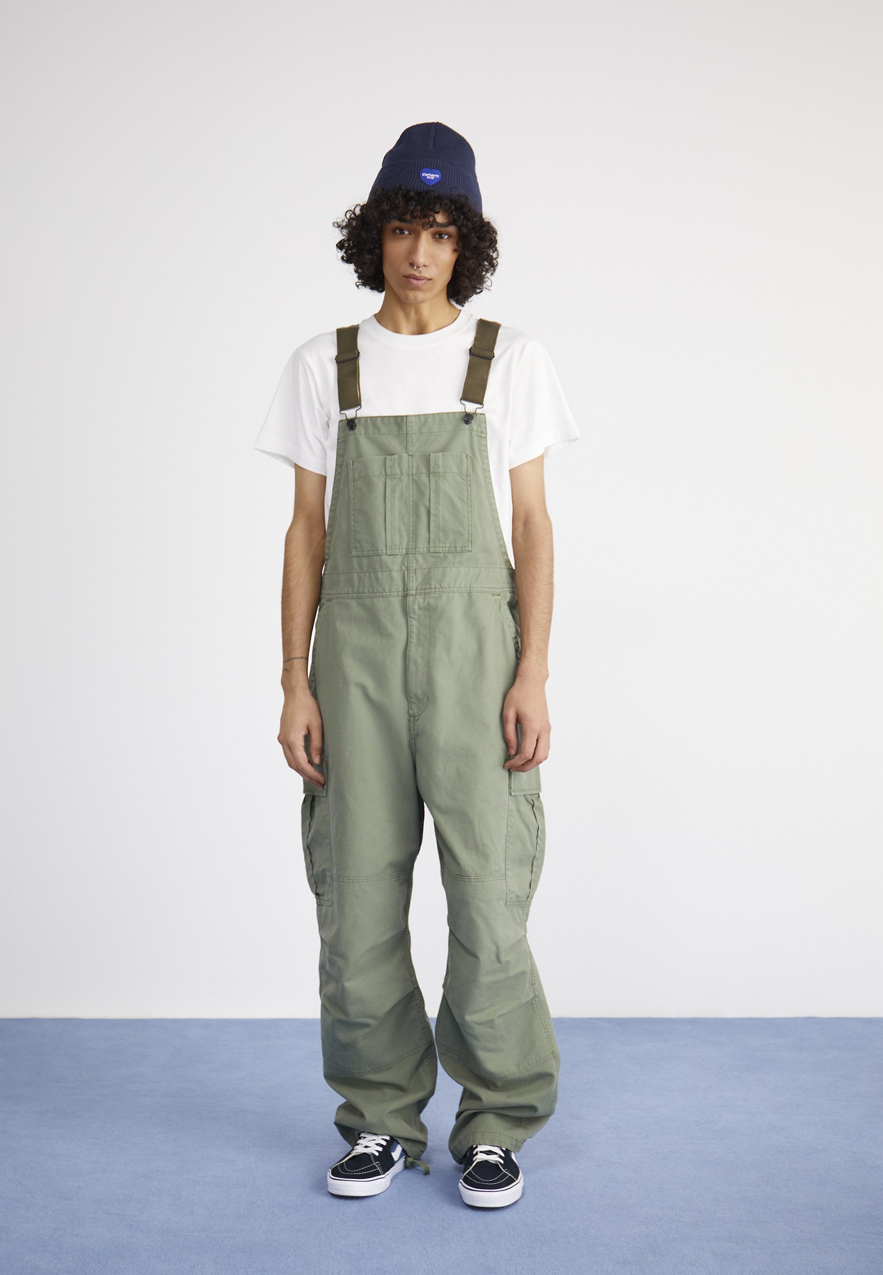 green carhartt bib overalls