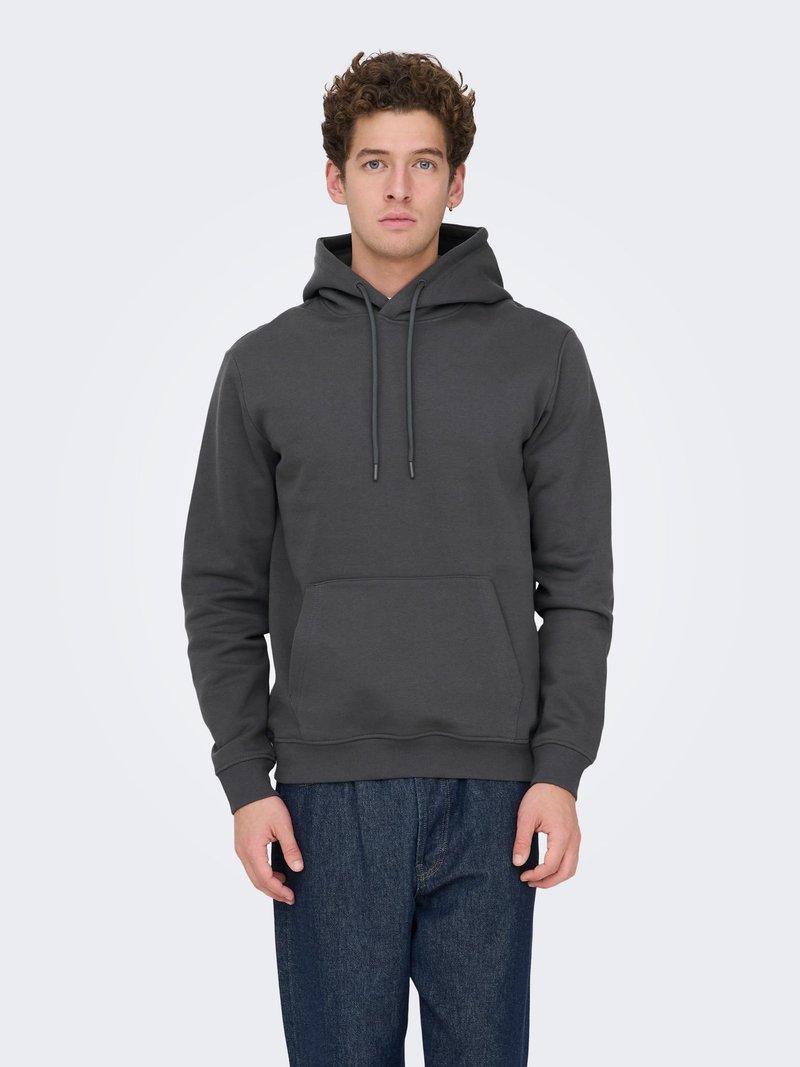 Gray fleece hoodie with a front kangaroo pocket, drawstring hood, ribbed cuffs, and hem. Paired with blue relaxed-fit jeans.